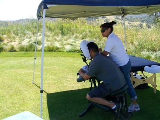 Yolanda offering Chair Massage at the CET Charity Golf Tournament