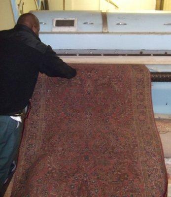 Pictured is our rug dusting process that removes harmful dust, dirt and allergens.  Call today for a free quote.  614-444-1193