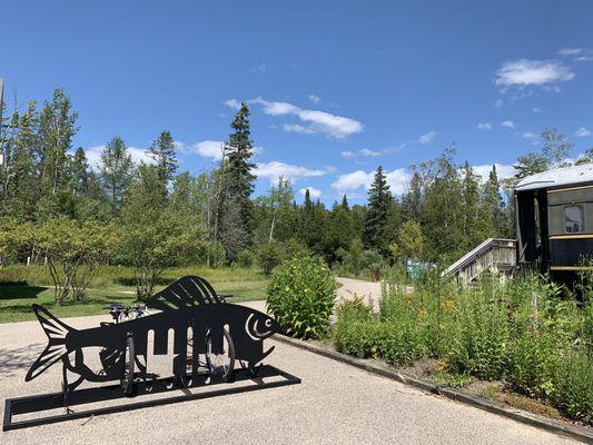 The trail behind the fish bike rack leads to the beautiful ponds.