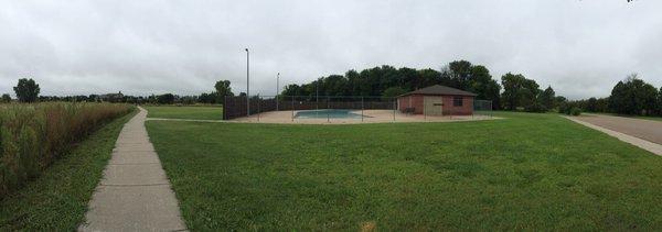 Swimming pool area and sidewalk heading to the bridge over to the Lodges and the Maybee Center.