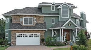 Need a new roof? Call Custom Construction Inc in Oxford, IA