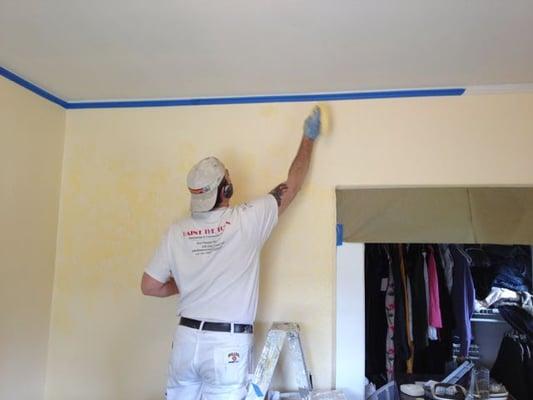 Paint the Town prepares a faux finish for the master bedroom. The color looked great and hid imperfections in the wall.