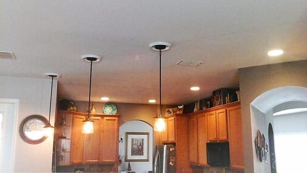 We added these can lights and pendant fixtures in this kitchen.