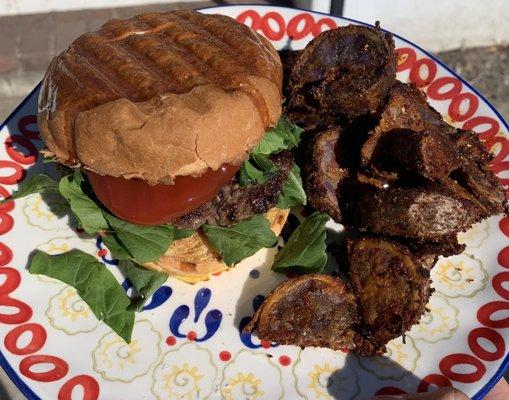 Irish Oaks Ranch premium ground beef, La Migliore Bakery brioche bun, Mt. Olive Farm greens, Templeton Valley Farms blue potatoes. All local