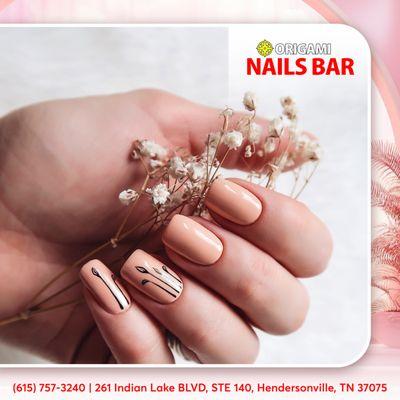 Spring into style with our chic short nude nail polish - the perfect understated elegance for the season's blossoming beauty!