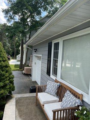 Another view of gutters and siding-close up of windows as well