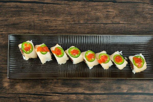 Unleash your taste buds with our Tiger Eyes roll! Mouthwatering combination of spicy tuna, creamy avocado, and a touch of fiery sauce