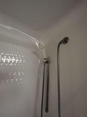 Shower head. I can't figure how someone in a wheelchair can reach that.