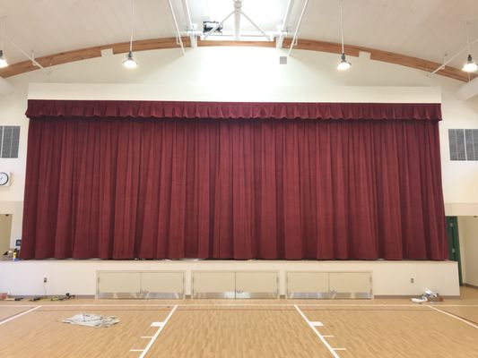 Stage Curtains and valance installed by Drapery Concepts