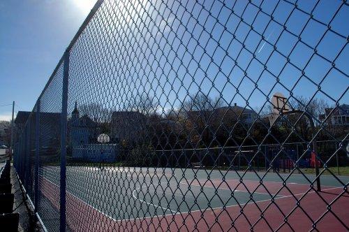 Black chain link around nice sport court