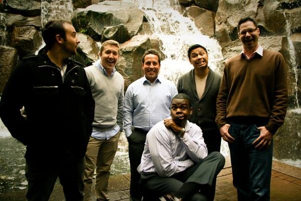 Rylem's Business Development Managers standing in front of the Waterfall Garden Park in Pioneer Square