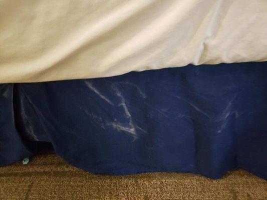 Something all over bed skirt. Bodily fluids?