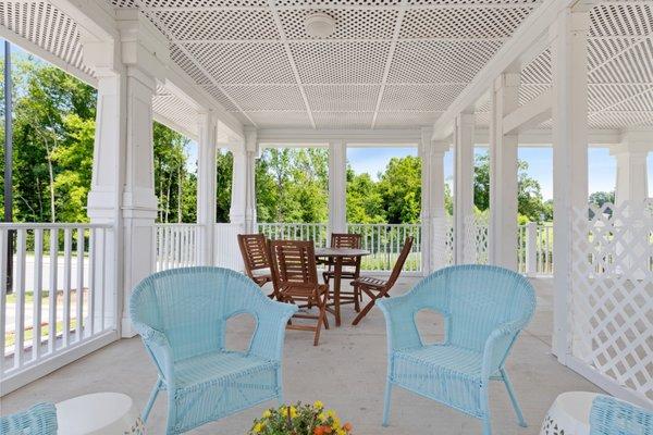 The covered community porch is perfect for breezy afternoons.