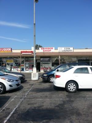 The outside.  Smashed between a laundry and liquor store