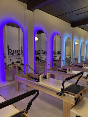 Beautiful reformer room and lighted mirrors