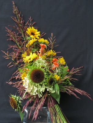 Sheave style bouquet of local flowers and grasses