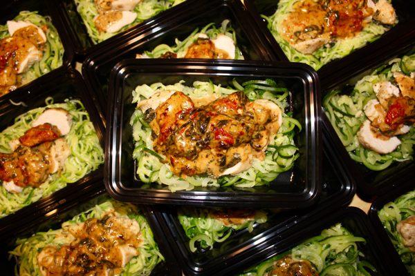 creamy tuscan chicken over zoodles