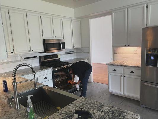 Cleaning the kitchen getting it ready for the open house