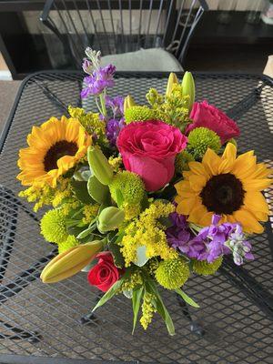 Floral bouquet of sunflowers and roses