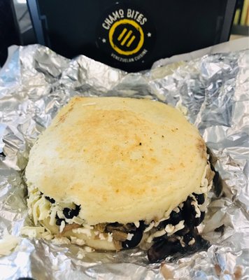 Arepa pabellon - shredded beef, sweet plantain, black beans, cheese