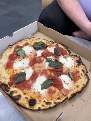 Margherita pizza with basil.