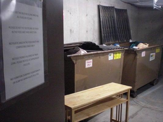 Wooden desk of sorts.  You'll also notice the tip of the recliner in the back dumpster. So much for the sign.