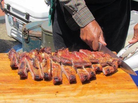 HOP Q-Team preparing their famous finger lickin' good rib dinners.