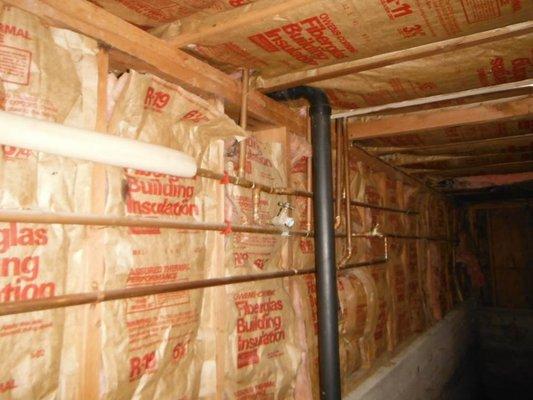 The paper facing on insulation is a vapor barrier, and always belongs on the warm side. Otherwise, it can trap moisture against the walls.