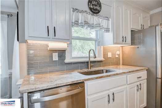 Small kitchen we recently update with white shaker cabinets and granite countertop