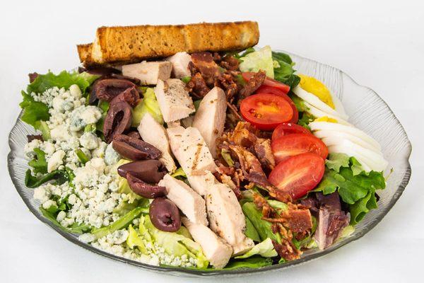 Cobb Salad - Fresh salad greens, diced chicken, bacon, hard boiled egg, gorgonzola crumbles, olives, tomato - Bleu cheese dressing