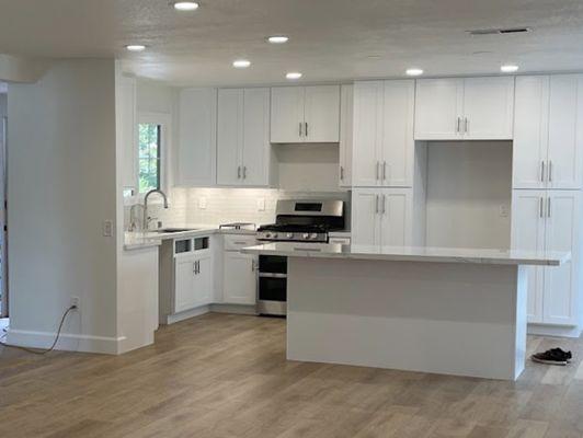 white shaker cabinet , adding island in the middle.