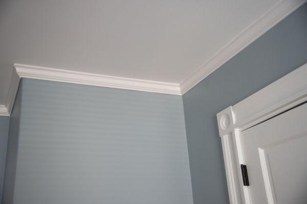 Installed crown moldings in this bedroom.