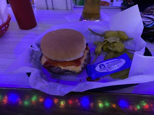 95¢ burger comes with cheese, onion, pickles, and peppercinis