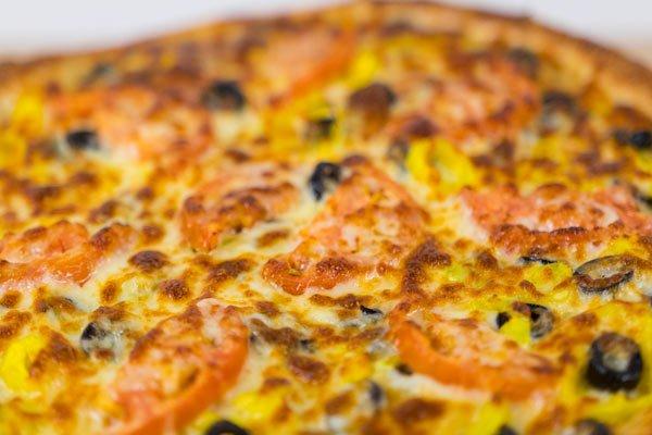 White pizza: White sauce, tomatoes, black olives, banana peppers.