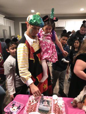 She was so happy with the clown and Minnie