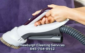 maid and house cleaning service from Newburgh Cleaning Services (845) 764-8912 steam cleaning an upholstery sofa and couch