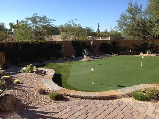 installation of putting green retainer wall plantings etc.