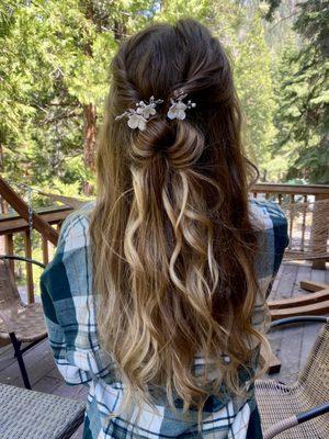 Loose waves and some twist with a bun for this beautiful bride