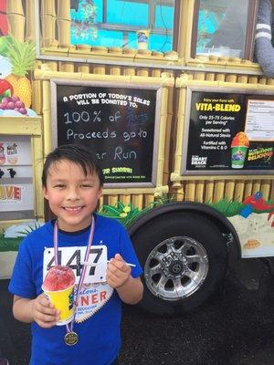 Gavin at kona ice during Bonner elementary run for education