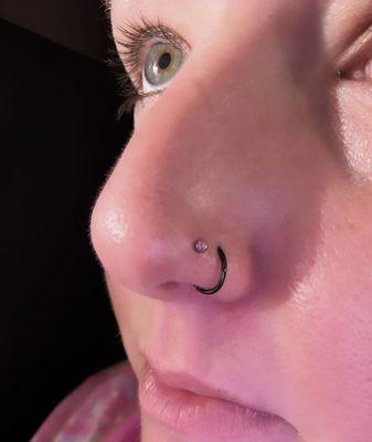 She did the stud piercing. Hoop was previously done years ago not by her.