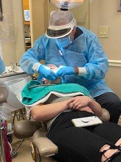 Dr. John Carson doing periodontal surgery