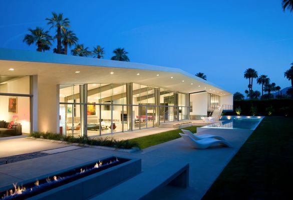 The heat and beauty of Palm Springs inspire this design: an enormous roof canopy with 4 pods tucked underneath containing the living spaces.