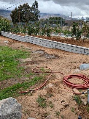 Installed 36' retaining wall left side of property.