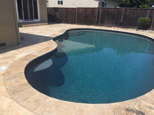 Full remodel plumbing pebble and travertine pavers and coping. Another great job.