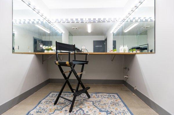 Our hair and makeup room comes equipped with an industrial steamer, wardrobe racks, and a make up counter.