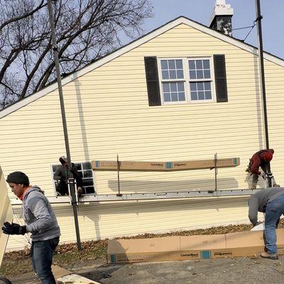 Certainteed siding being installed on a residential home