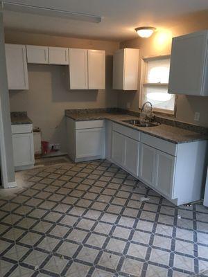 Kitchen cabinets and countertops install.