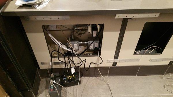 Adding the cabling and POS switch beneath the counter for Starbucks