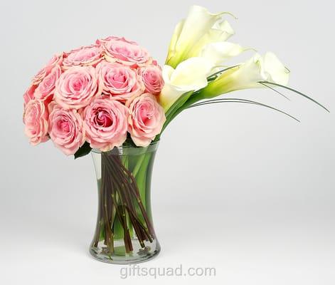 Perfectly grouped Roses paired with pure White Calla Lilies make up this modern vase arrangement. 140.00