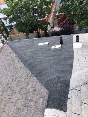 Sectional roof replacement done by us. Old roof taken down by us and a new layer of shingle put down.